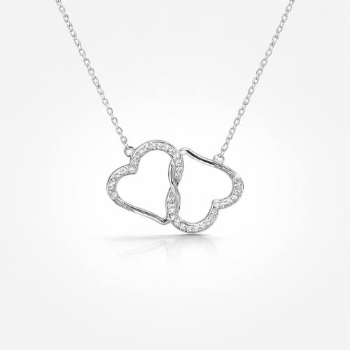 Silver necklace with a heart-shaped pendant on a white background
