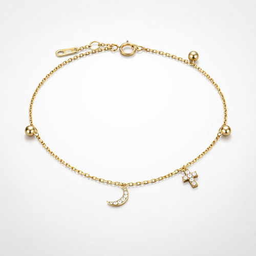 Gold bracelet with charms on a light gray background