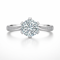 Diamond ring with a large central gemstone and smaller stones on the band against a white background