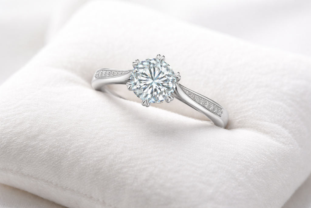 Silver ring with a diamond on a white cushion