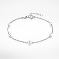 Silver bracelet with pearls on a white background