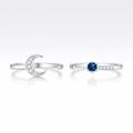 Two silver rings with gemstones on a white background