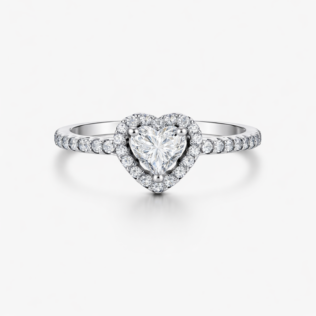 Heart-shaped diamond ring with a white gold band on a light gray background
