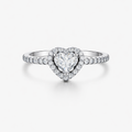 Heart-shaped diamond ring with a white gold band on a light gray background