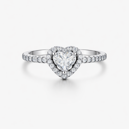 Heart-shaped diamond ring with a white gold band on a light gray background