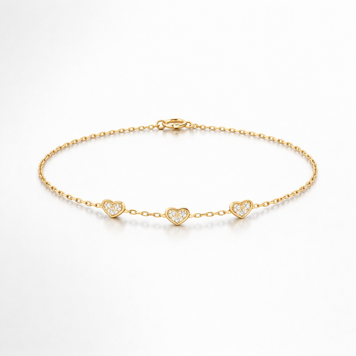 Gold bracelet with heart-shaped charms on a white background