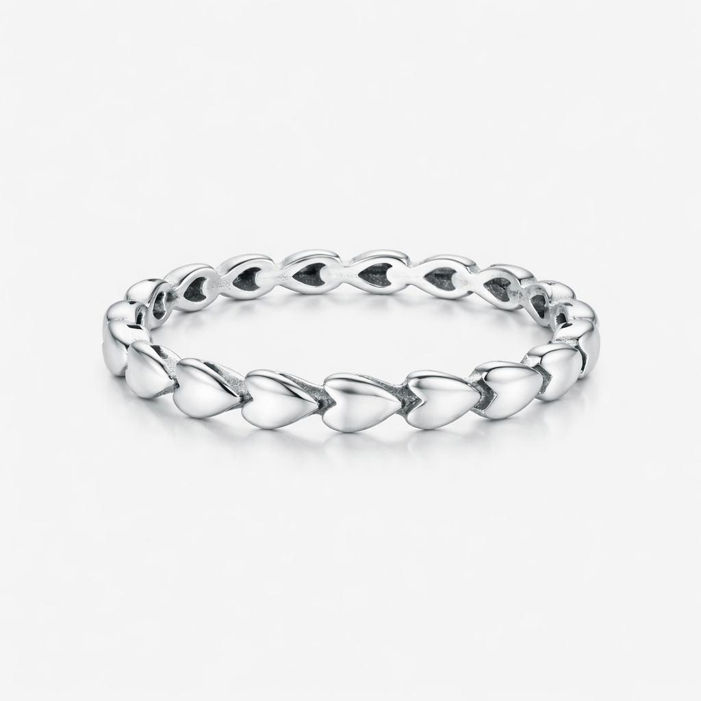 Silver ring with a unique design on a white background