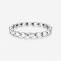 Silver ring with a unique design on a white background