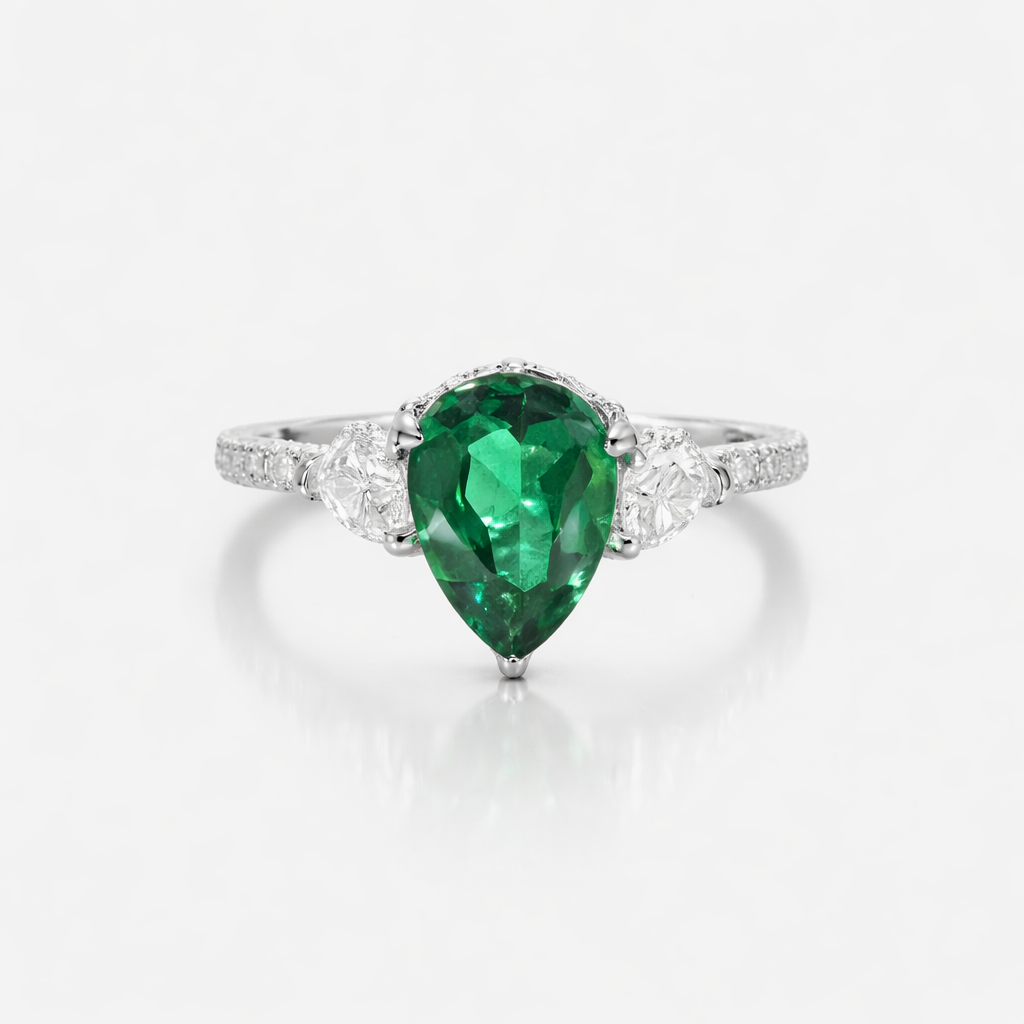 Ring with a green gemstone on a white background
