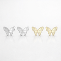 Butterfly-shaped earrings in silver, gold, and rose gold on a light gray background