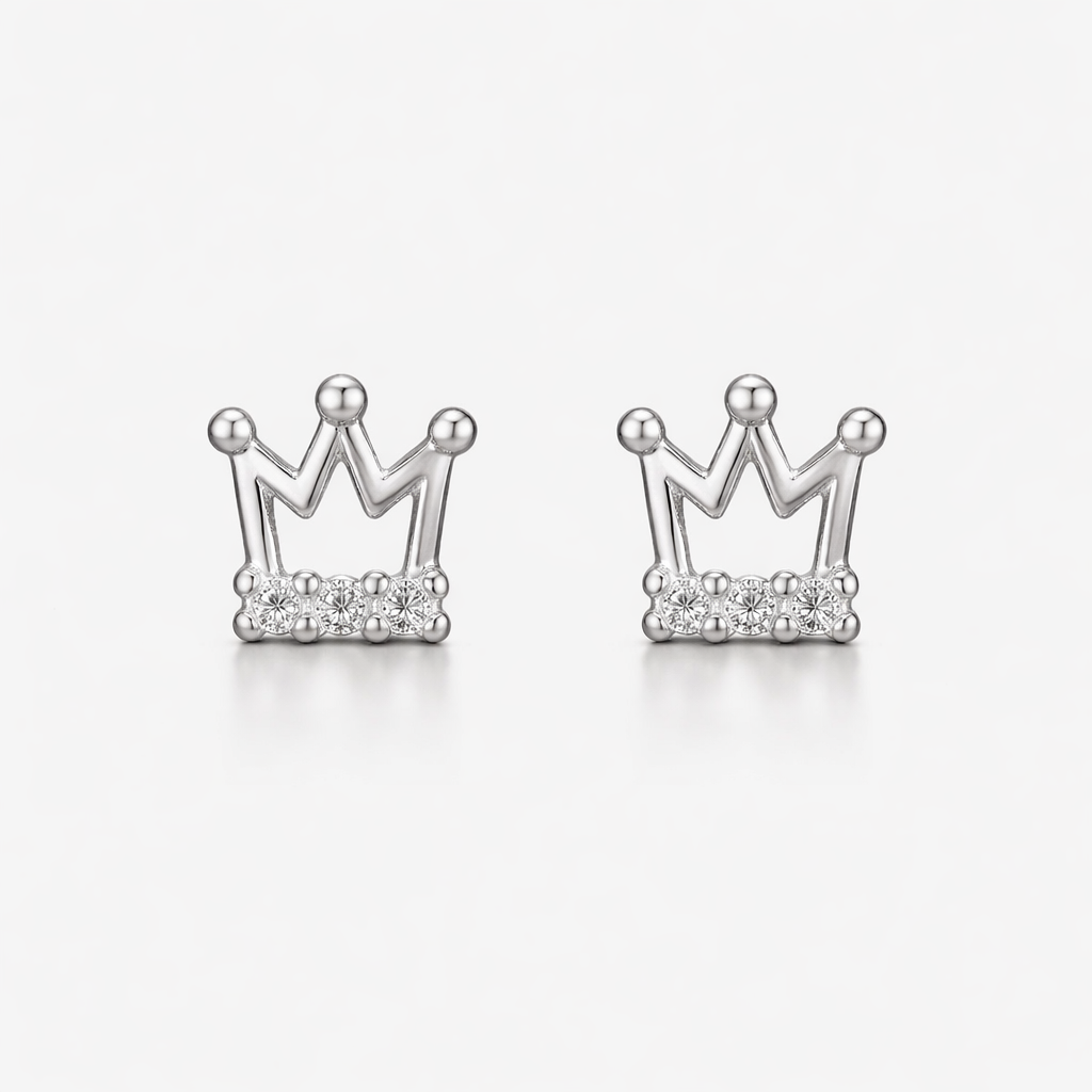 Silver crown-shaped earrings on a white background