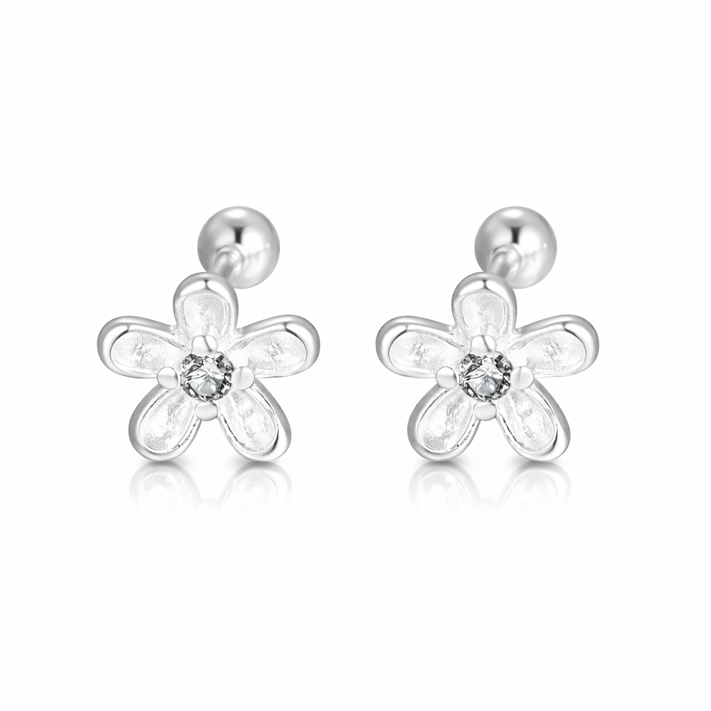 Silver flower-shaped earrings with clear gemstones on a white background