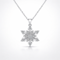 Silver snowflake pendant necklace on a white background