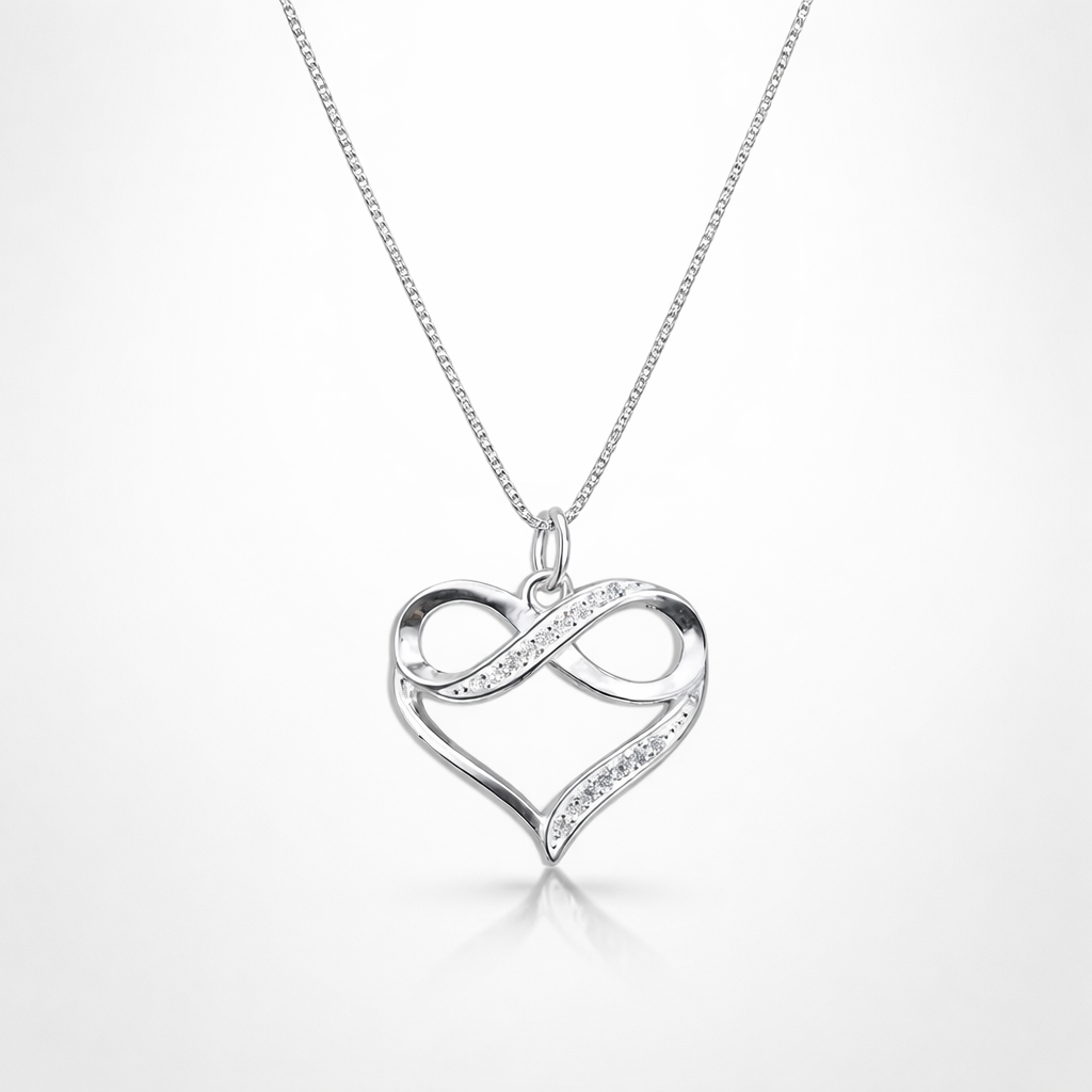 Silver heart-shaped pendant with infinity symbol on a white background