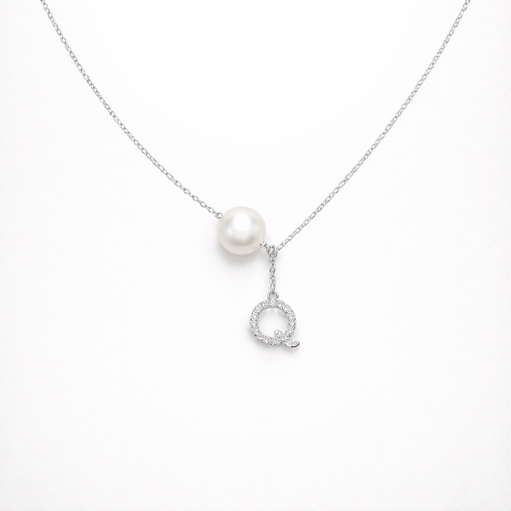 Pearl necklace with a silver pendant on a white background