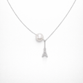 Necklace with a pearl pendant and Eiffel Tower charm on a white background