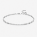 Silver bracelet with small diamonds on a light gray background