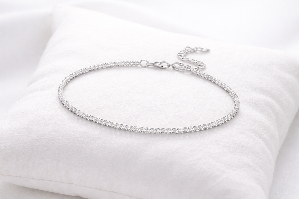 Silver bracelet on a white cushion
