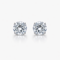 Pair of diamond stud earrings on a white background