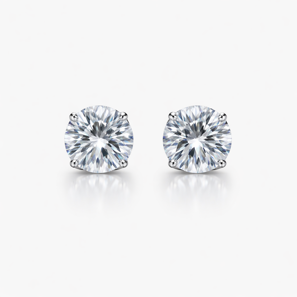 Pair of diamond stud earrings on a white background