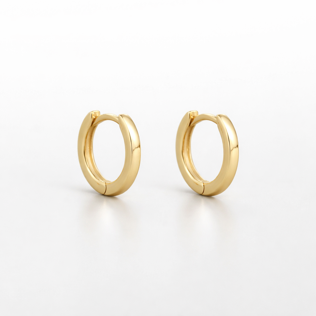Gold hoop earrings on a white background