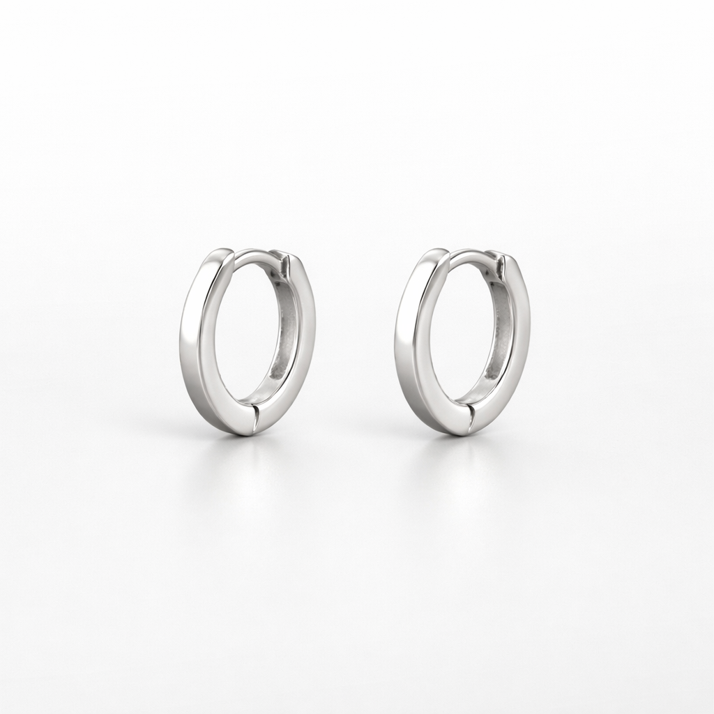 Pair of silver hoop earrings on a white background