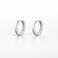 Pair of silver hoop earrings on a white background