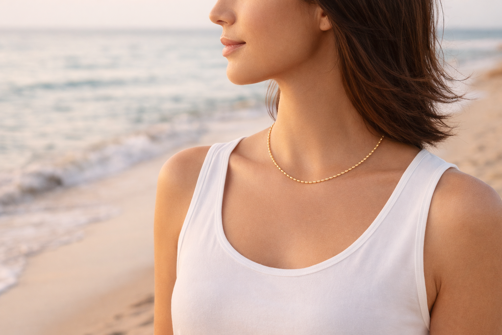 gold necklace seaside beach