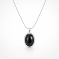 Black pendant necklace on a white background