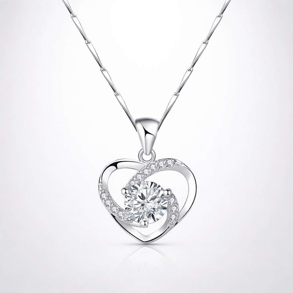 Silver heart-shaped pendant necklace on a white background