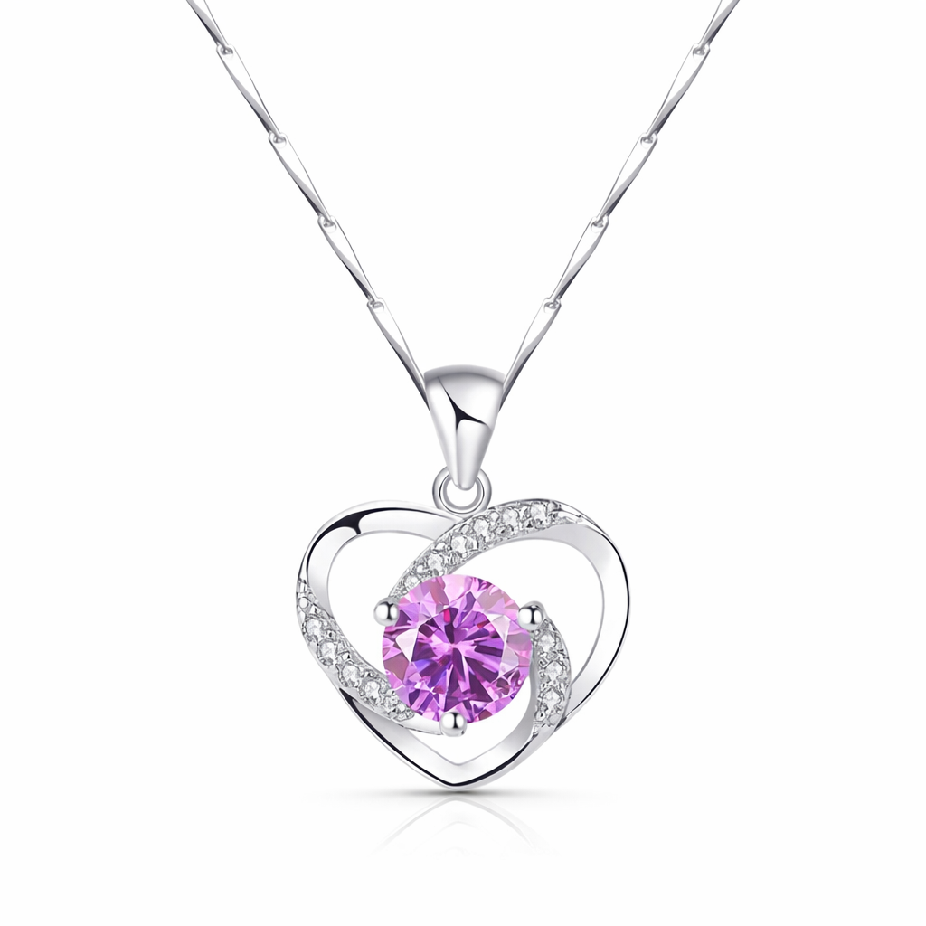 Silver necklace with a heart-shaped pendant featuring a pink gemstone on a white background