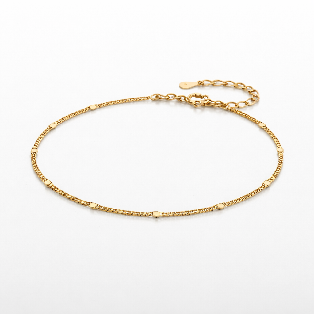 Gold anklet on a white background