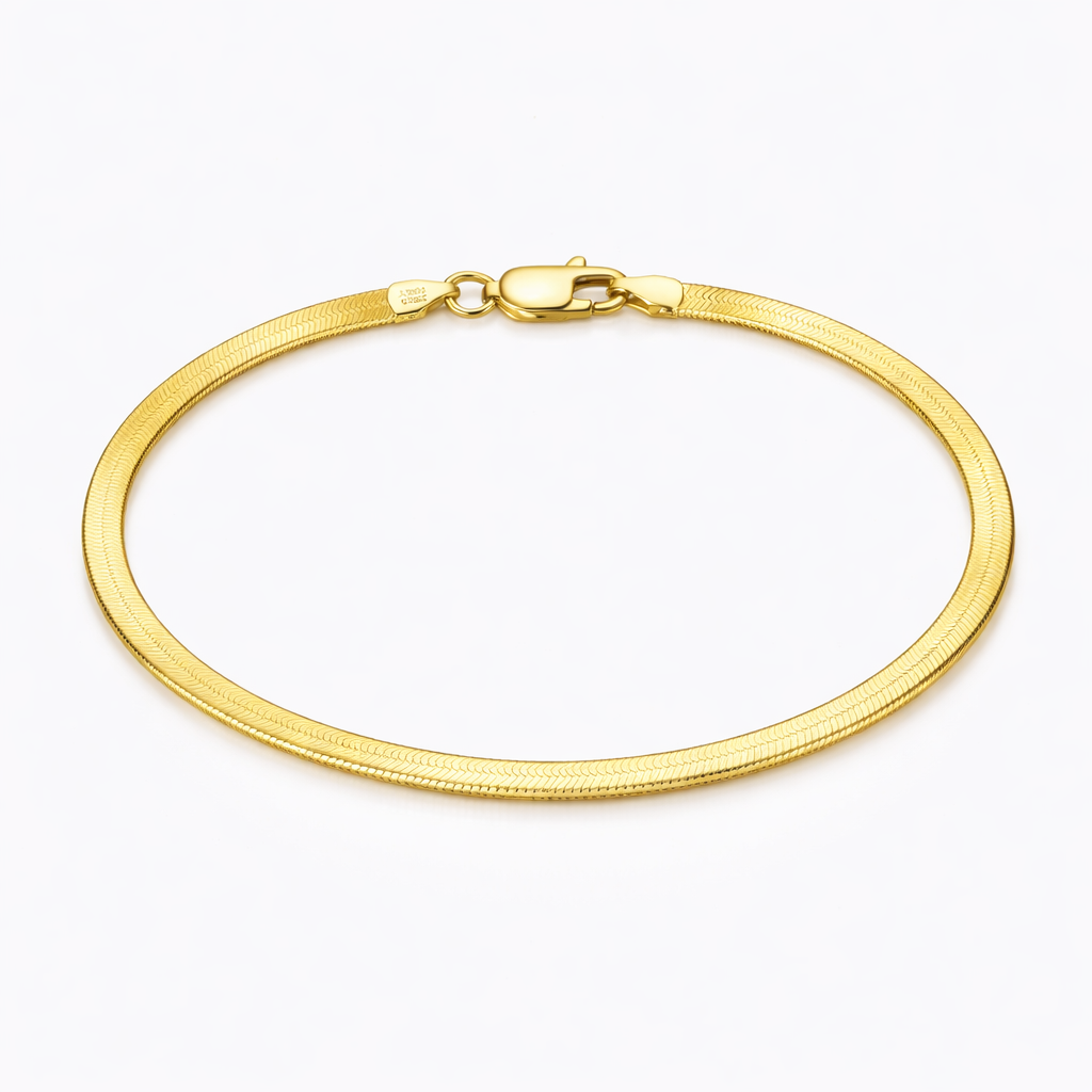 Gold bracelet on a white background