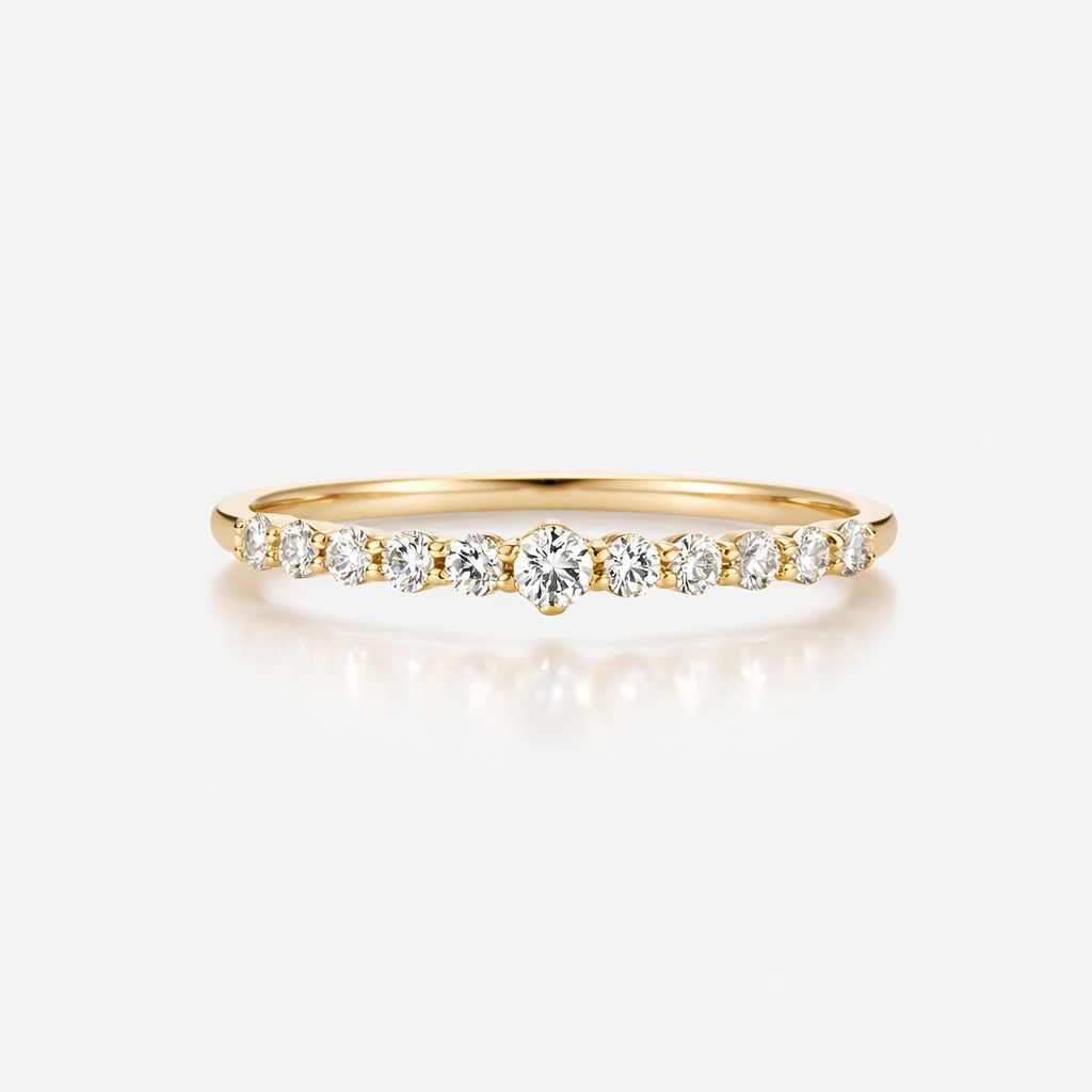 Gold ring with diamonds on a white background