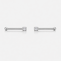 Pair of silver barbell earrings with clear gemstones on a white background