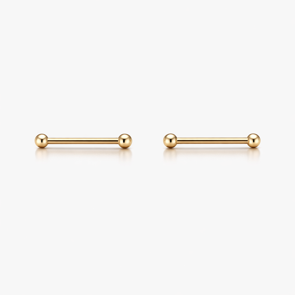 Pair of gold bar earrings on a white background