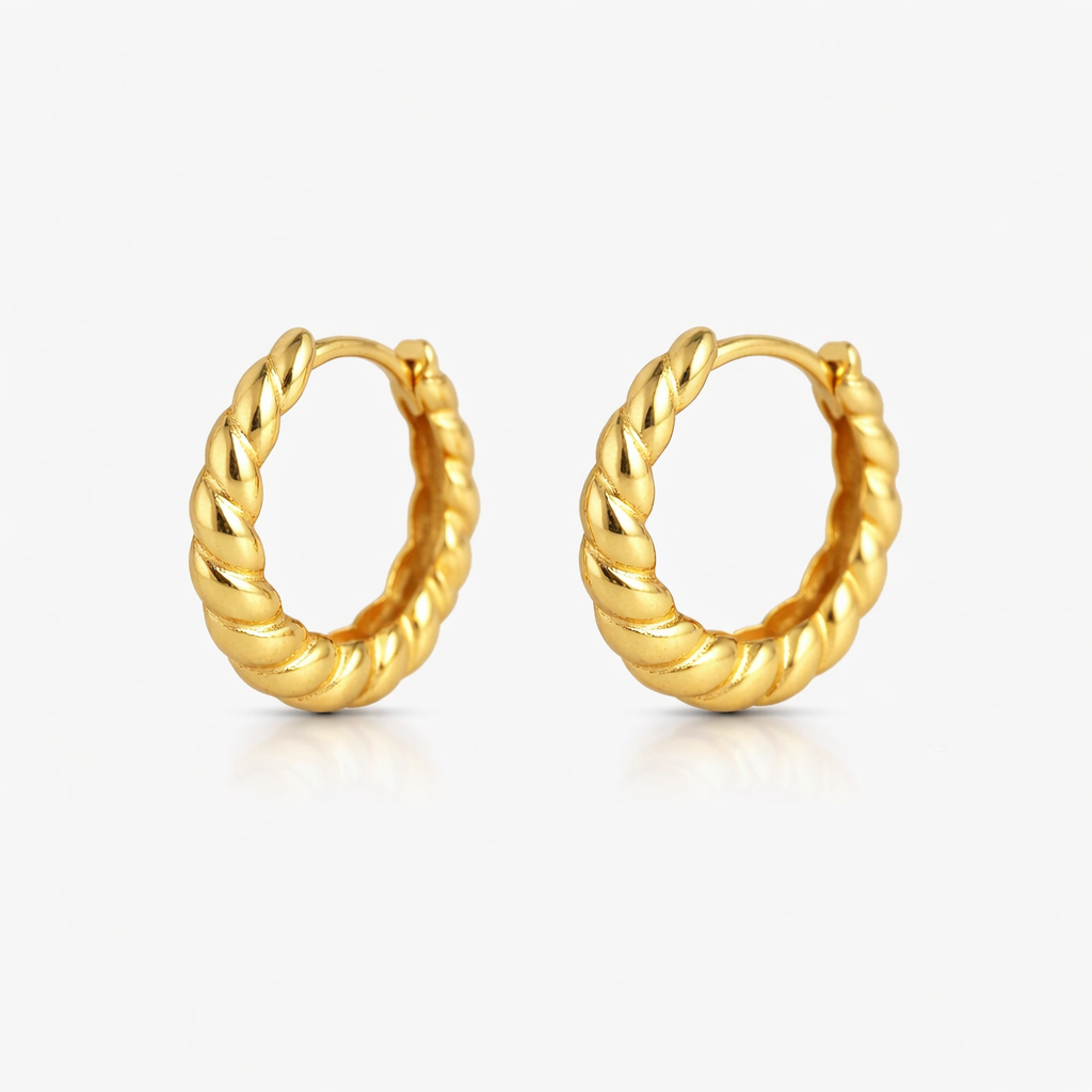 Pair of gold hoop earrings on a white background