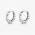 Pair of silver hoop earrings on a white background