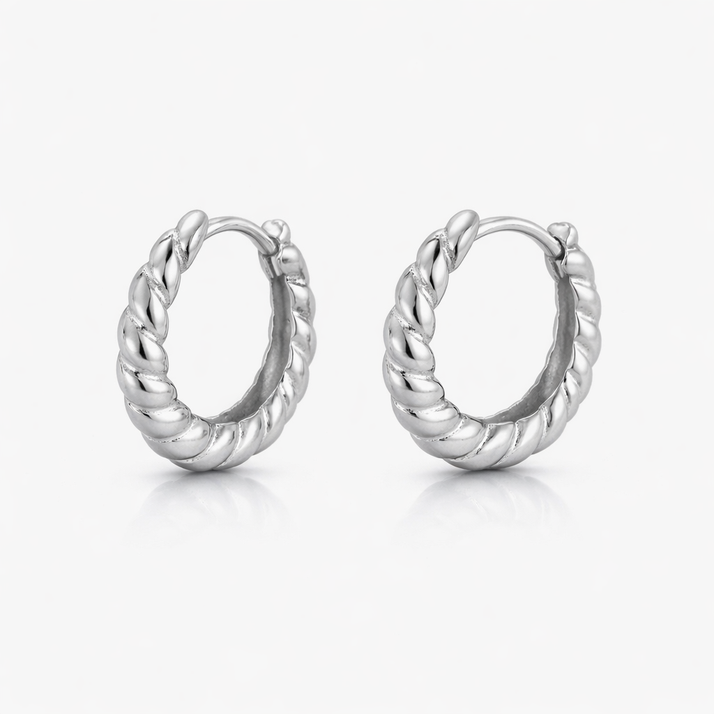 Pair of silver hoop earrings on a white background