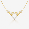Gold necklace with a heart-shaped pendant on a white background