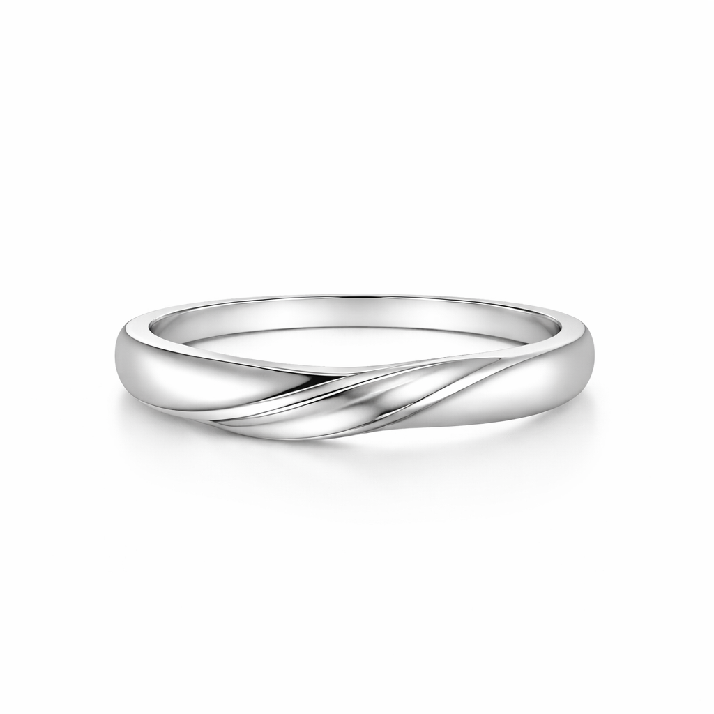 Silver ring with a twisted design on a white background