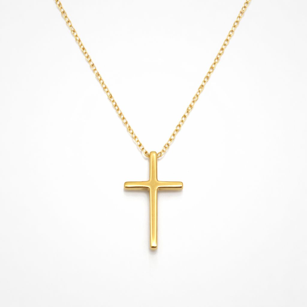 Gold cross necklace on a white background