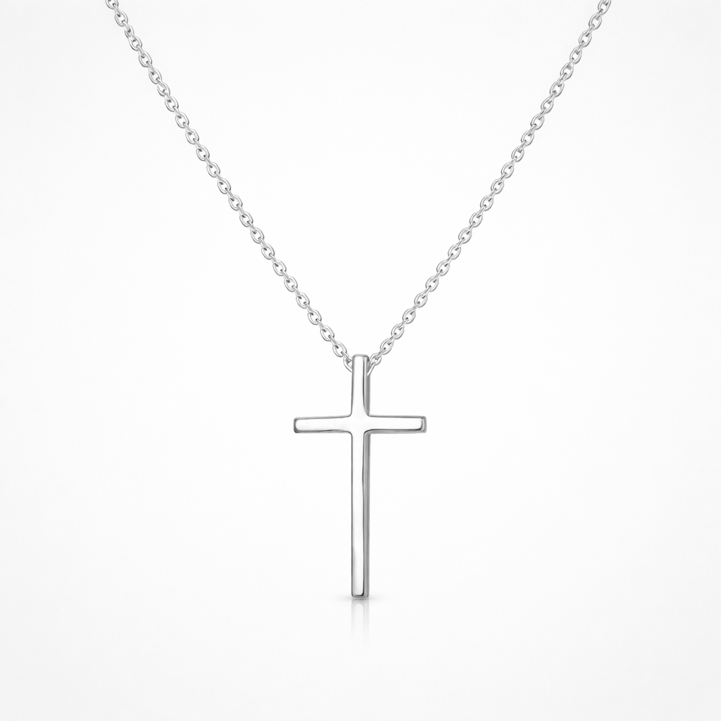 Silver cross necklace on a white background