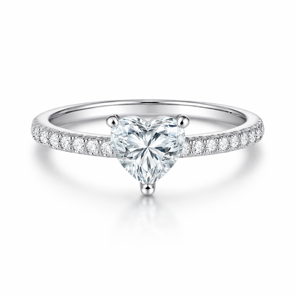 Heart-shaped diamond ring with a white gold band on a white background