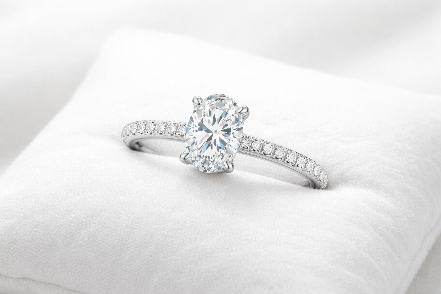 silver diamond ring on white background