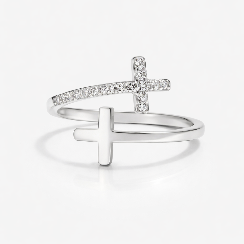 Silver cross-shaped ring on a white background