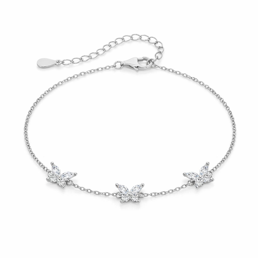 Silver bracelet with butterfly charms on a white background