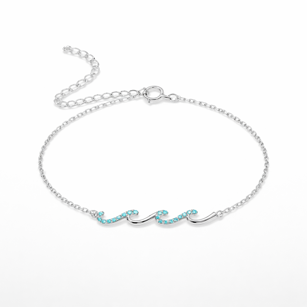 Silver bracelet with turquoise stones on a white background